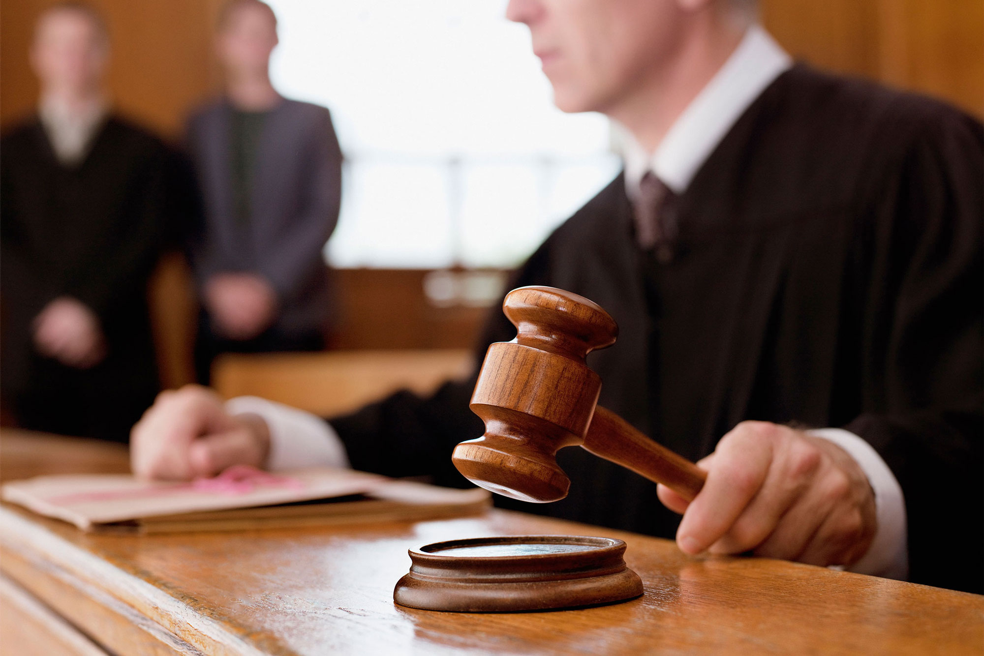 judge hitting gavel in court room